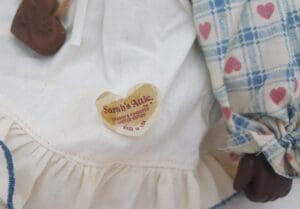 Heart-shaped label on doll's dress.