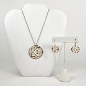 Necklace and earrings with geometric design.