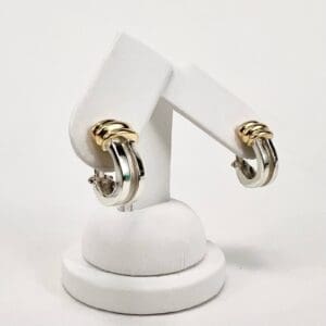 Gold and silver hoop earrings on display.