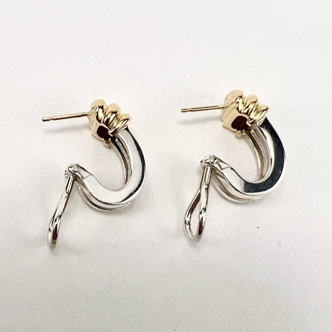 Gold and silver hoop earrings on display.