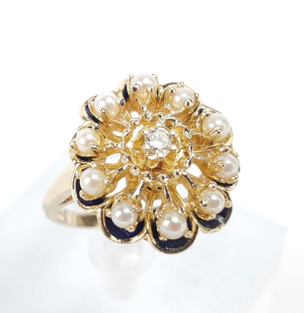 Gold floral ring with pearls and diamond.