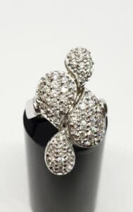 Silver ring with intricate diamond design.
