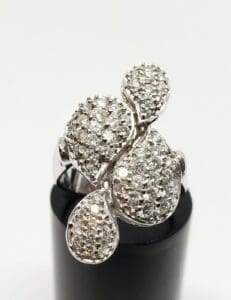 Diamond-studded silver ring with unique design.