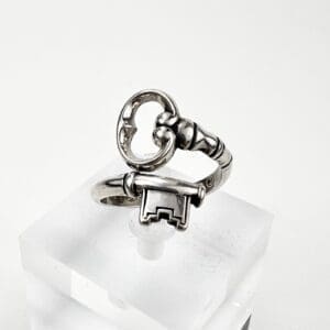 Silver ring shaped like a vintage key.