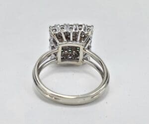 Silver ring with intricate gemstone setting.
