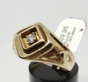 Gold ring with a small diamond.