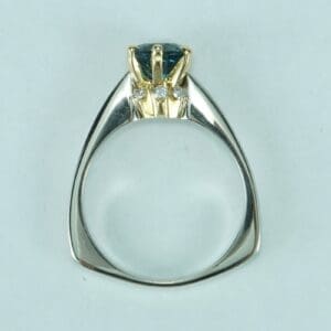 Gold and silver ring with blue gemstone.