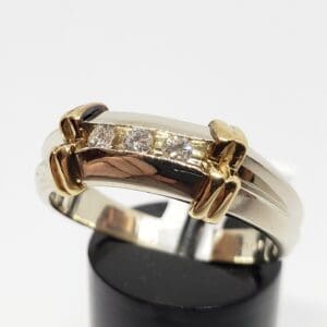 Gold and silver ring with diamonds.