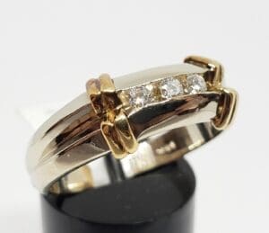 Gold and silver ring with diamonds.
