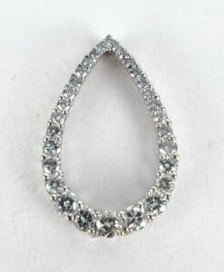 Teardrop-shaped diamond pendant on white background.