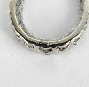 Silver ring with scalloped edges, close-up.