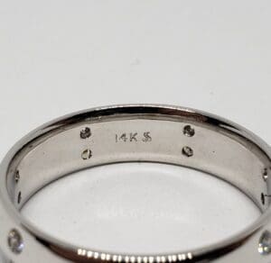 14K silver ring with small gemstones.