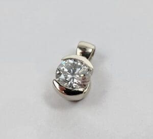 Diamond pendant with silver setting.