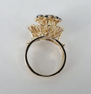 Ornate gold ring with intricate design.