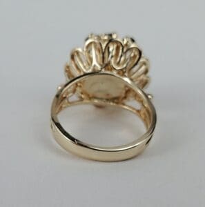 Gold ring with intricate design details.