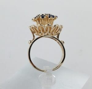 Gold ring with intricate floral design.