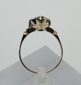 Gold ring with intricate animal design.