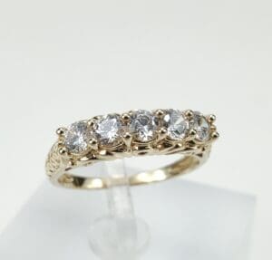 Gold ring with six sparkling diamonds.