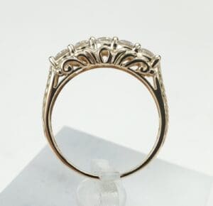 Gold ring with intricate gemstone setting.