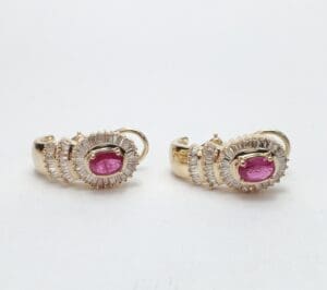 Gold earrings with pink gemstones and diamonds.