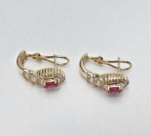 Gold earrings with pink gemstones and diamonds.