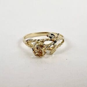 Gold ring with intricate floral design.
