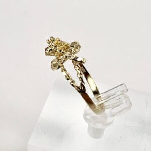 Gold ring with intricate floral design.