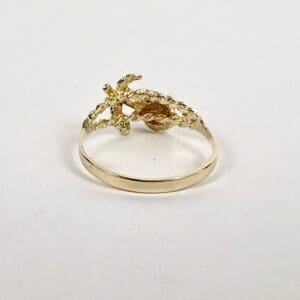 Gold ring with crocodile design.