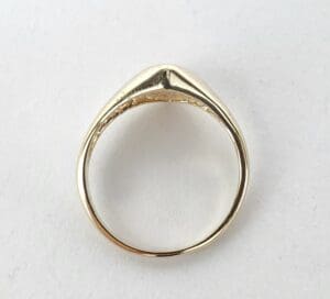 Gold ring on a white background.
