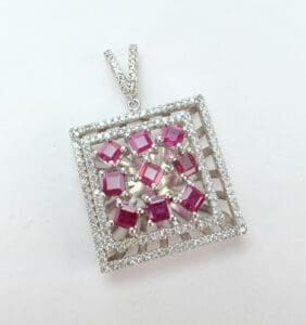 Square pendant with pink gemstones and diamonds.