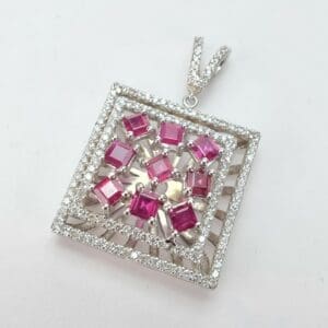 Square pendant with pink and white stones.
