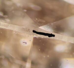 Close-up of a diamond with GIA inscription.