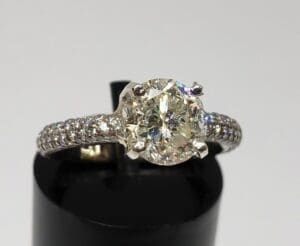 Diamond ring with a sparkling gemstone centerpiece.