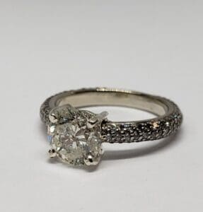 Diamond ring with intricate detailed band.