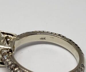 18K gold ring with diamond accents.