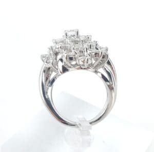 Silver ring with square diamond cluster design.