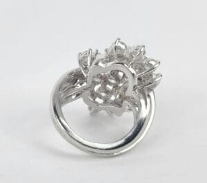 Silver ring with intricate floral design.