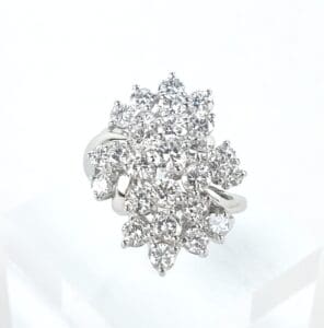 Diamond cluster ring on white background.