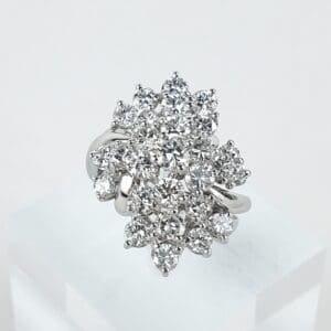 Diamond cluster ring with silver band.
