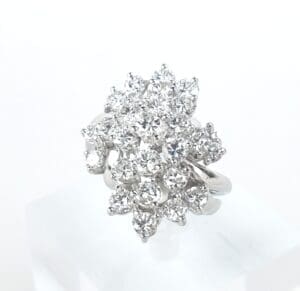 Diamond cluster ring on white background.
