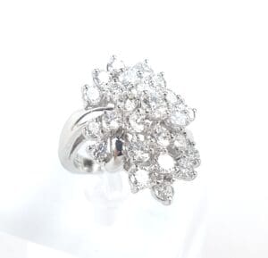 Silver ring with multiple sparkling diamonds.