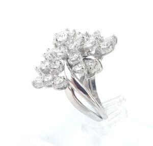 Silver ring with multiple sparkling diamonds.