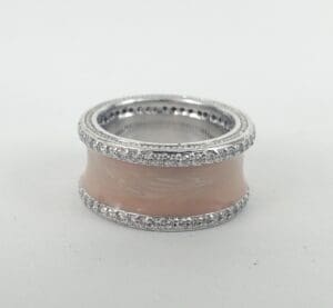 Silver and pink enamel ring with crystals.