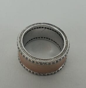 Silver and rose gold ring with diamonds.