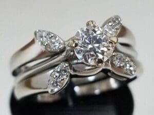 Diamond ring with floral design setting.