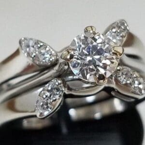 Diamond ring with floral design setting.