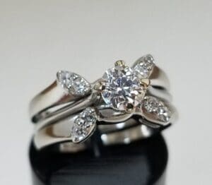 Diamond ring with multiple smaller diamonds.