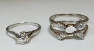 Silver rings with diamond settings.