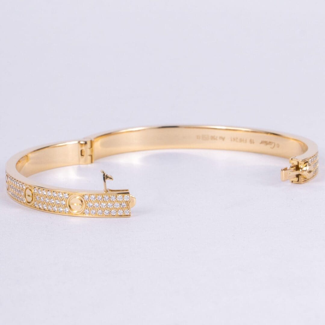 Gold bracelet with diamond accents.