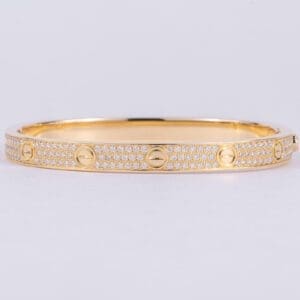Gold bracelet with diamond accents.